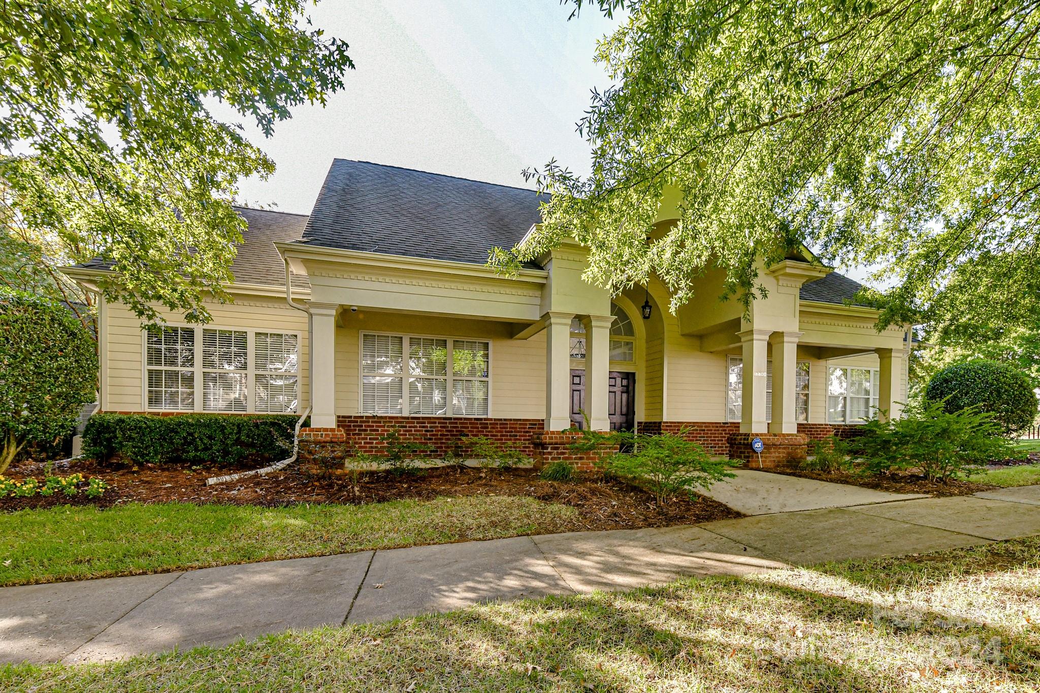 9665 Bailey Road Cornelius, NC 28031 - Photo 29 of 31 a front view of a house with a yard and outdoor seating