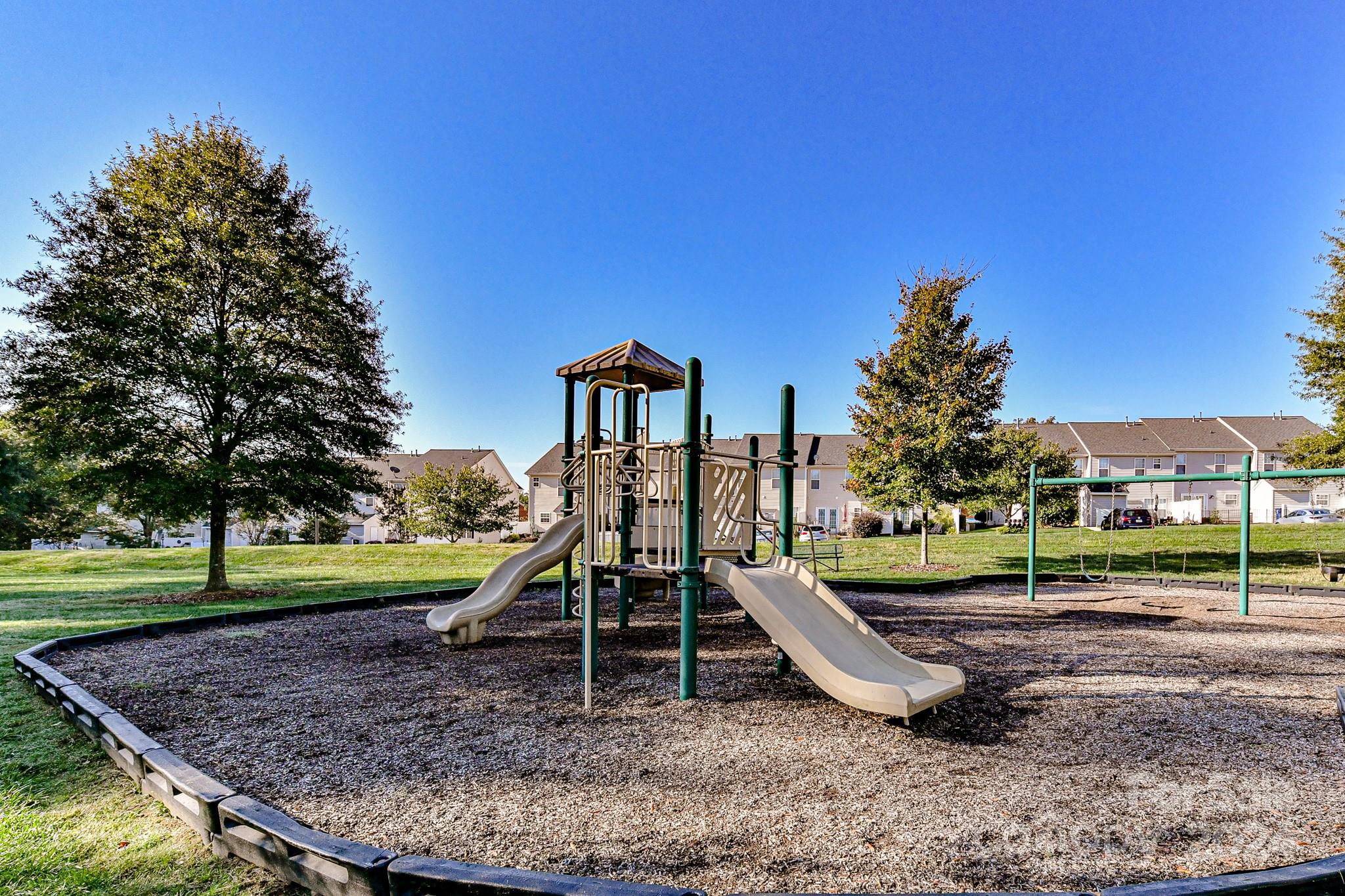 9665 Bailey Road Cornelius, NC 28031 - Photo 30 of 31 a view of a park with swings