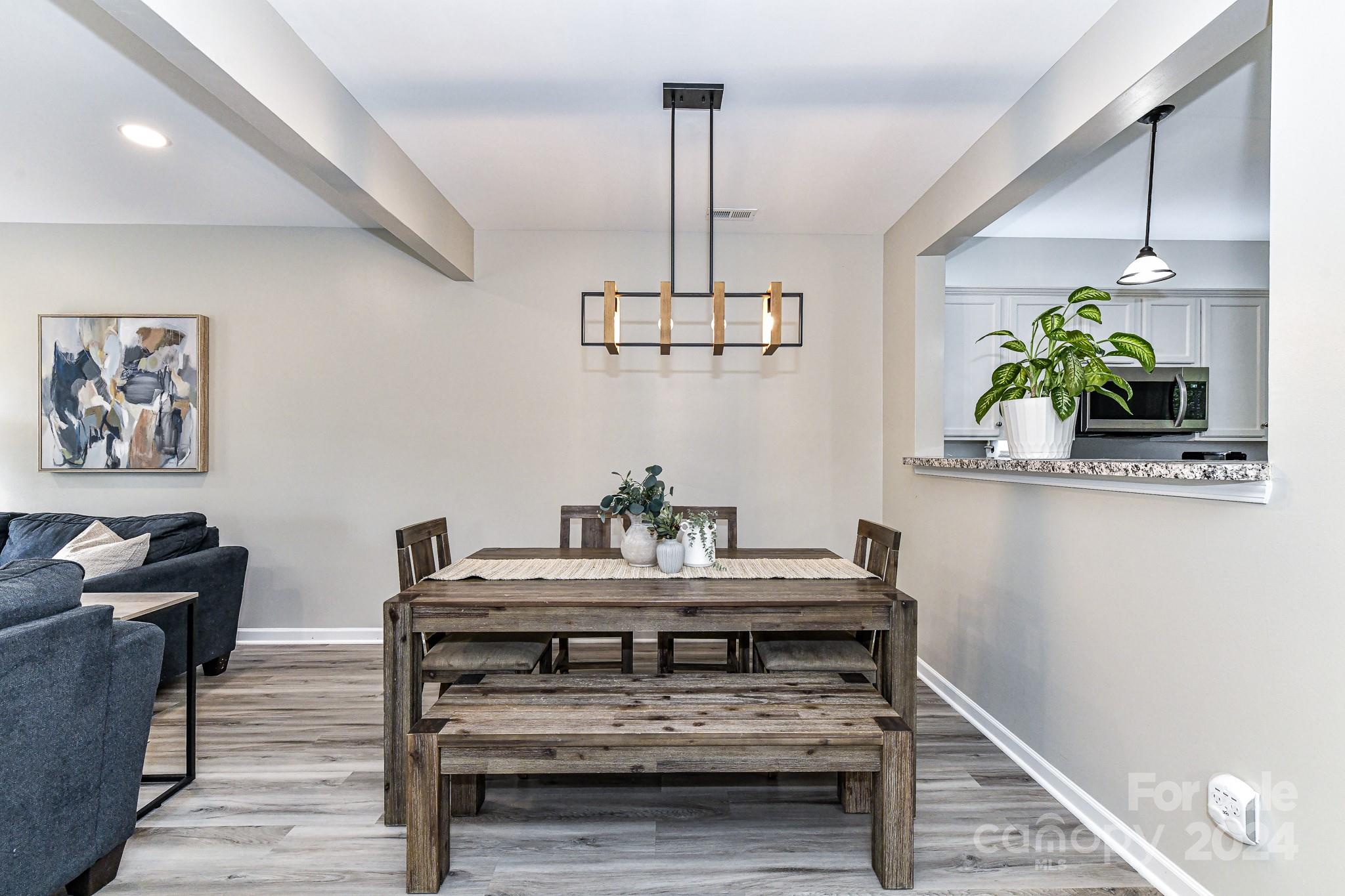9665 Bailey Road Cornelius, NC 28031 - Photo 8 of 31 a view of dining room and wooden floor