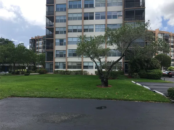 an empty room with a empty space and windows