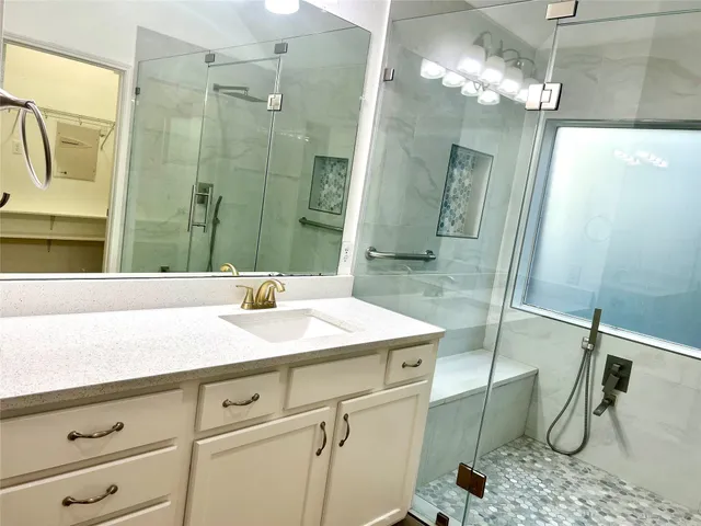 a bathroom with a sink and a mirror