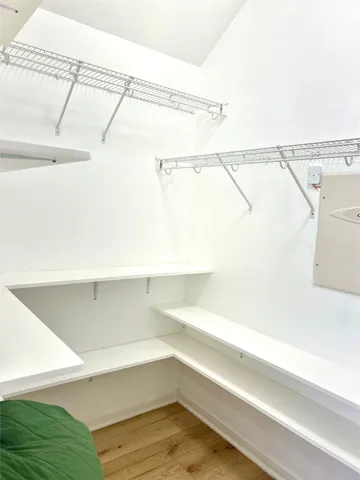 a view of a room with racks on the wall