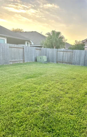a view of a backyard with green space