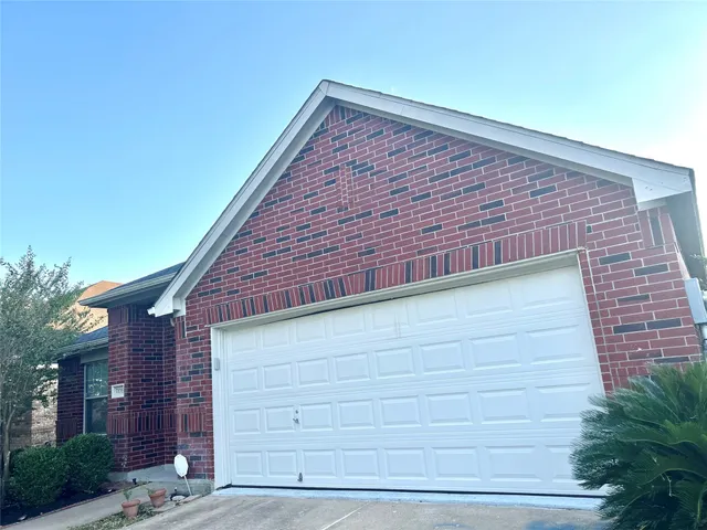 a view of backyard with a wooden fence