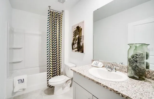 a bedroom with a bed and dresser