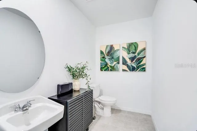 a bedroom with a bed a couch and dresser