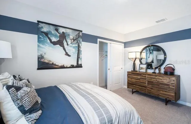 a bathroom that has a glass shower door