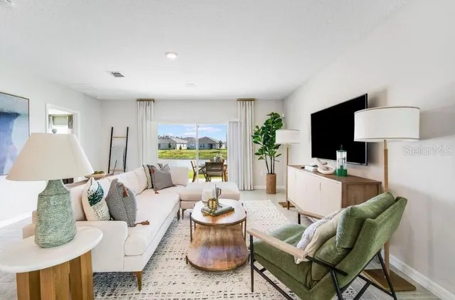 a view of kitchen with stainless steel appliances granite countertop lots of counter top space