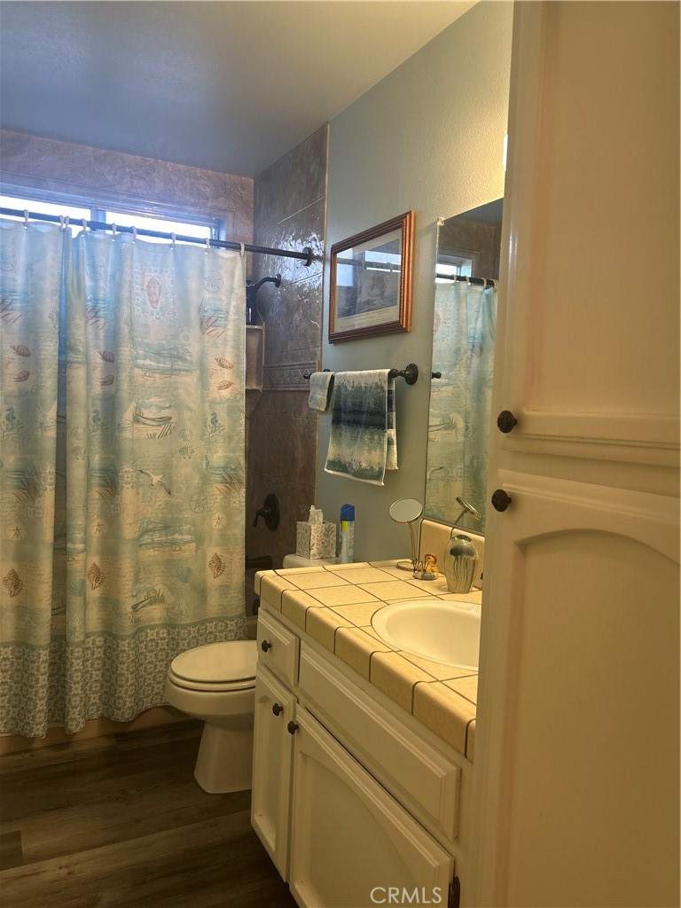 562 Bakeman Lane Arroyo Grande, CA 93420 - Photo 21 of 35 a bathroom with a sink a toilet and shower