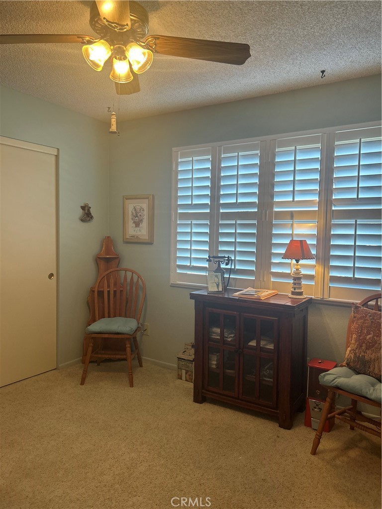 562 Bakeman Lane Arroyo Grande, CA 93420 - Photo 22 of 35 a spacious bedroom with a bed and a chair