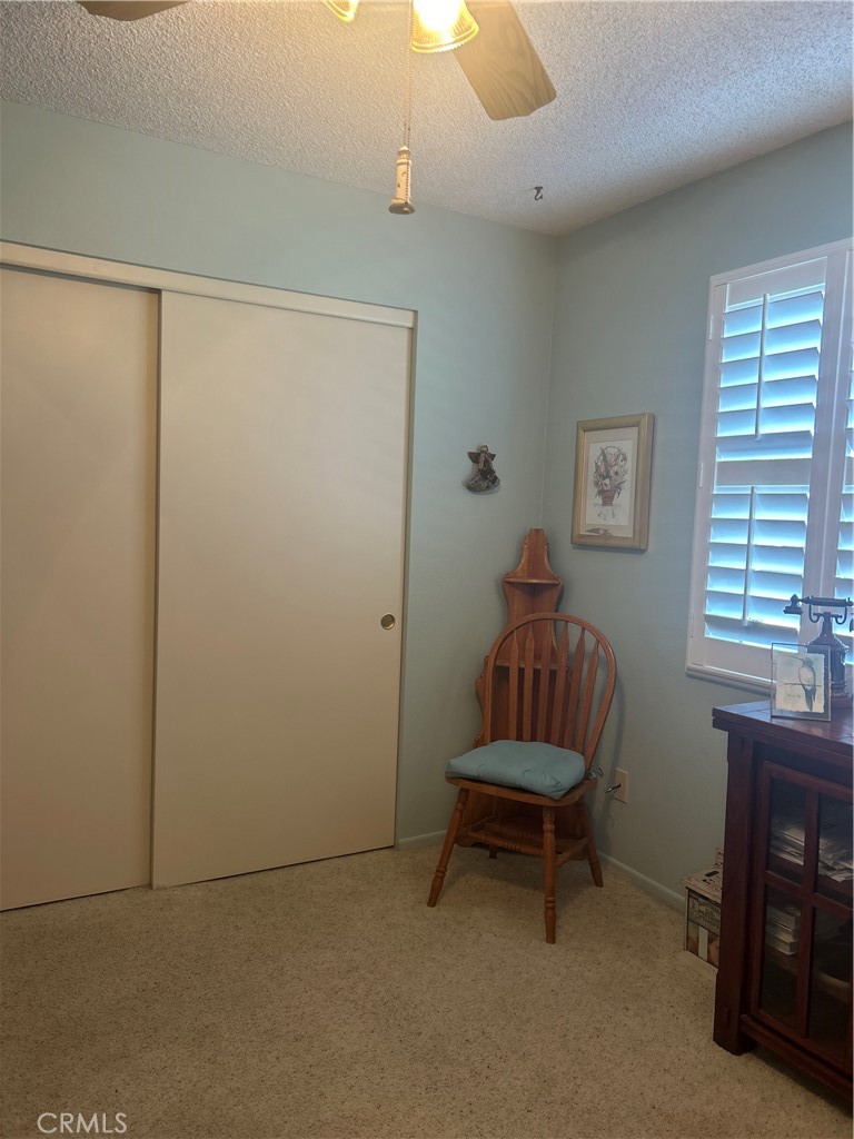 562 Bakeman Lane Arroyo Grande, CA 93420 - Photo 23 of 35 a living room with a chair and a window