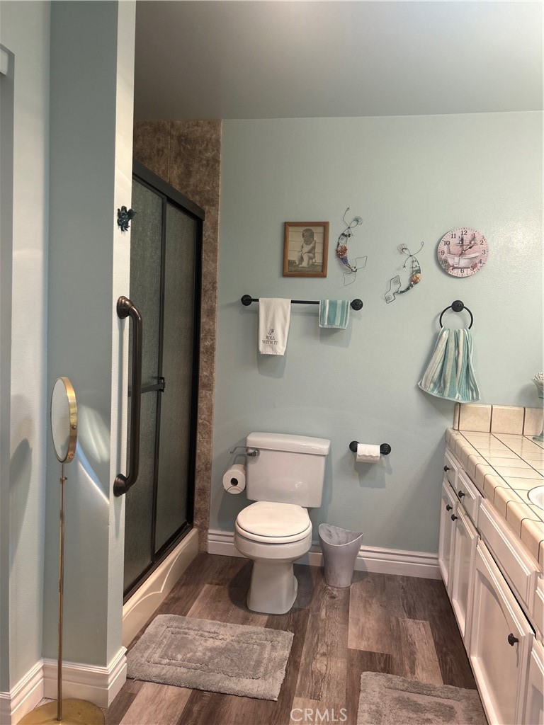 562 Bakeman Lane Arroyo Grande, CA 93420 - Photo 27 of 35 a bathroom with a toilet and a sink