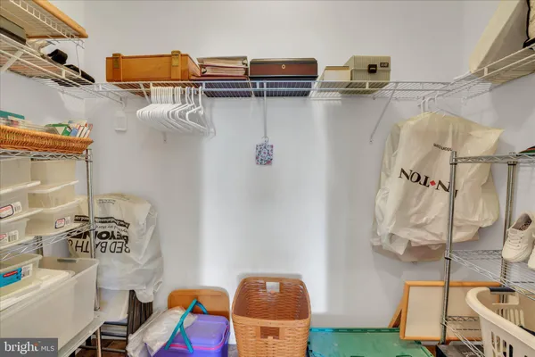 a view of storage and utility room with racks on the wall