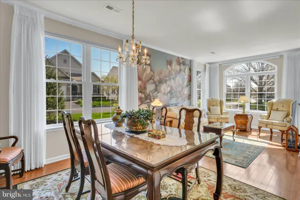 a view of a dining room with furniture window and outside view