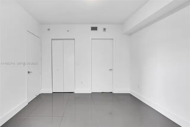 a bathroom with a double vanity sink mirror double and bathtub