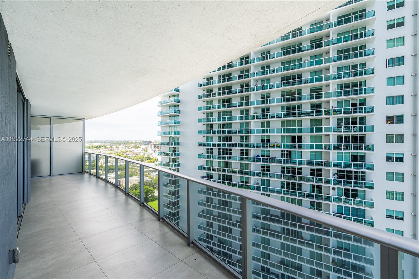 488 Northeast 18th Street, Unit 2311 Miami, FL 33132 - Photo 2 of 40 a view of balcony with couch