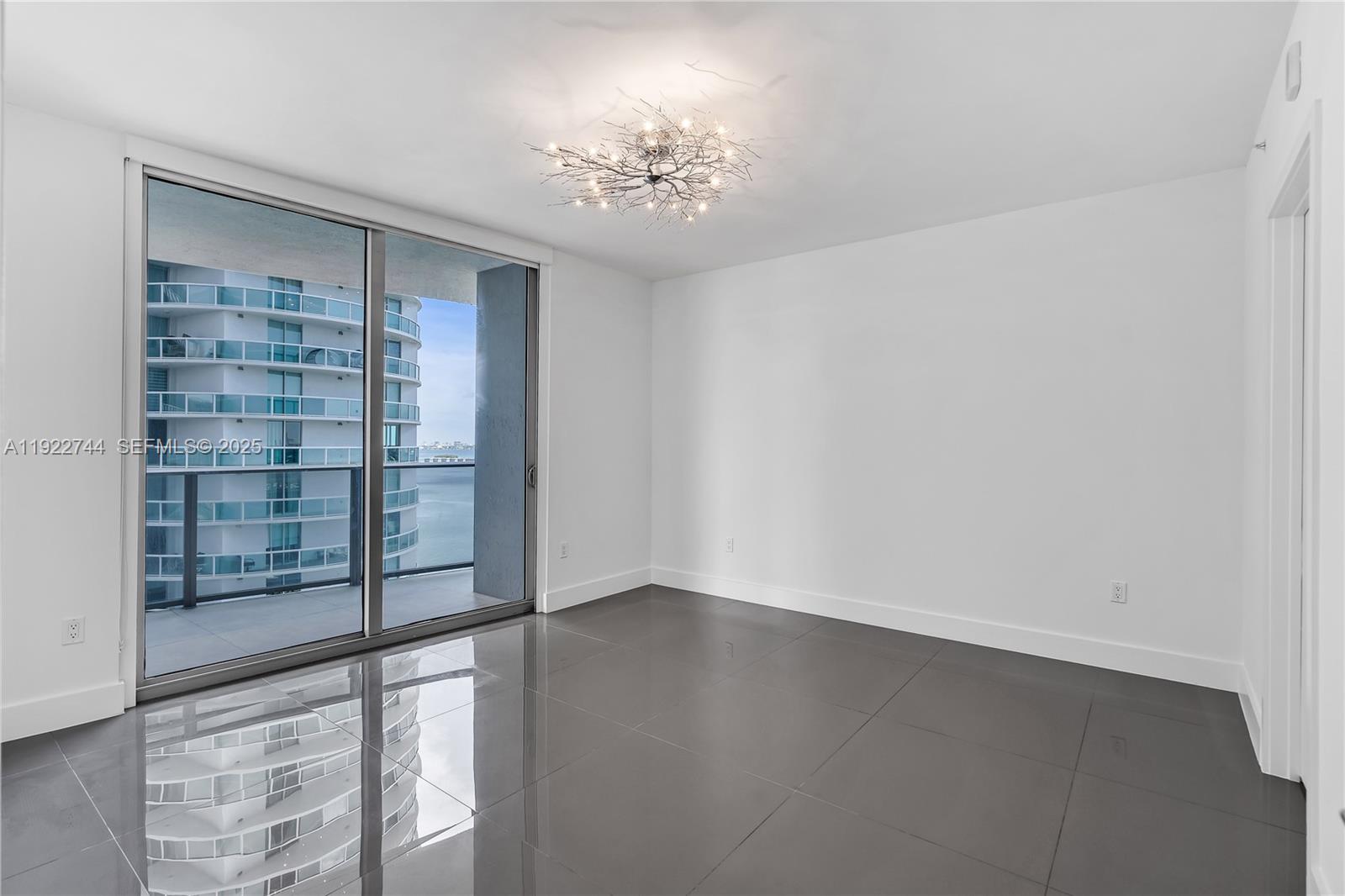 488 Northeast 18th Street, Unit 2311 Miami, FL 33132 - Photo 23 of 40 a view of an empty room with a window