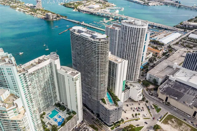 a view of roof deck with outdoor seating and city view