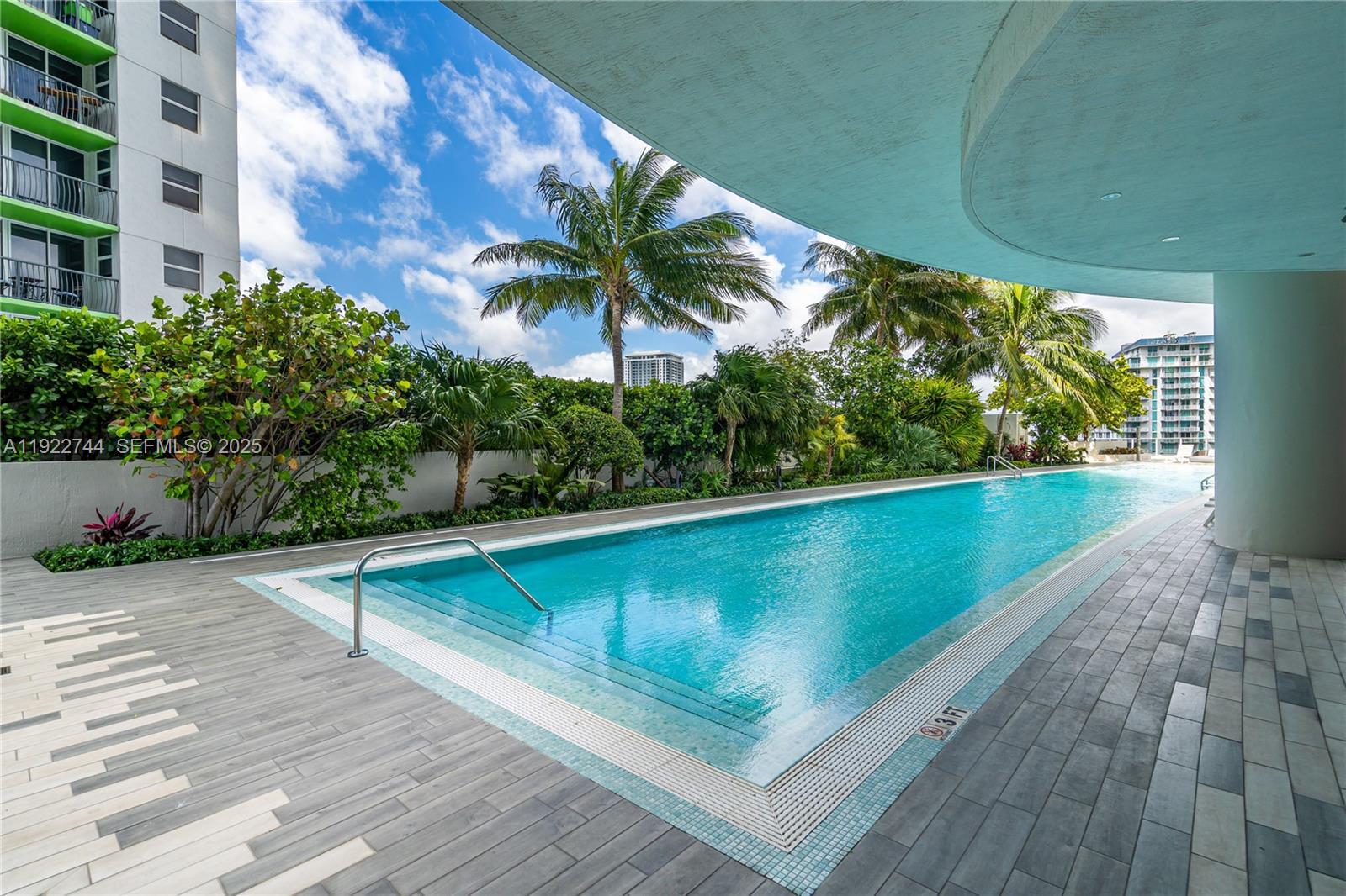 488 Northeast 18th Street, Unit 2311 Miami, FL 33132 - Photo 35 of 40 a view of swimming pool with outdoor seating