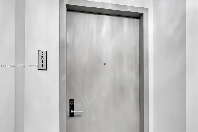 a bathroom with a shower and a mirror