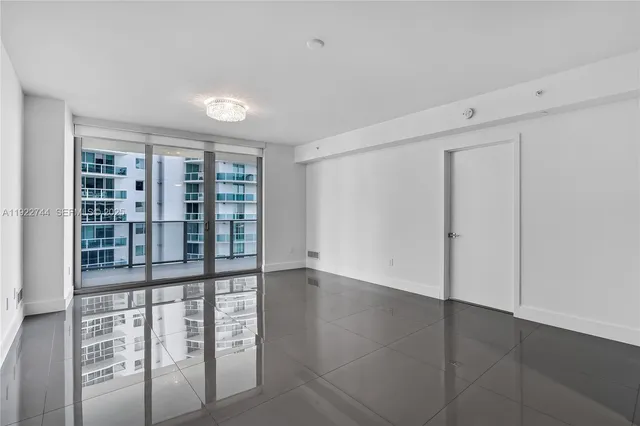 a view of empty room with windows