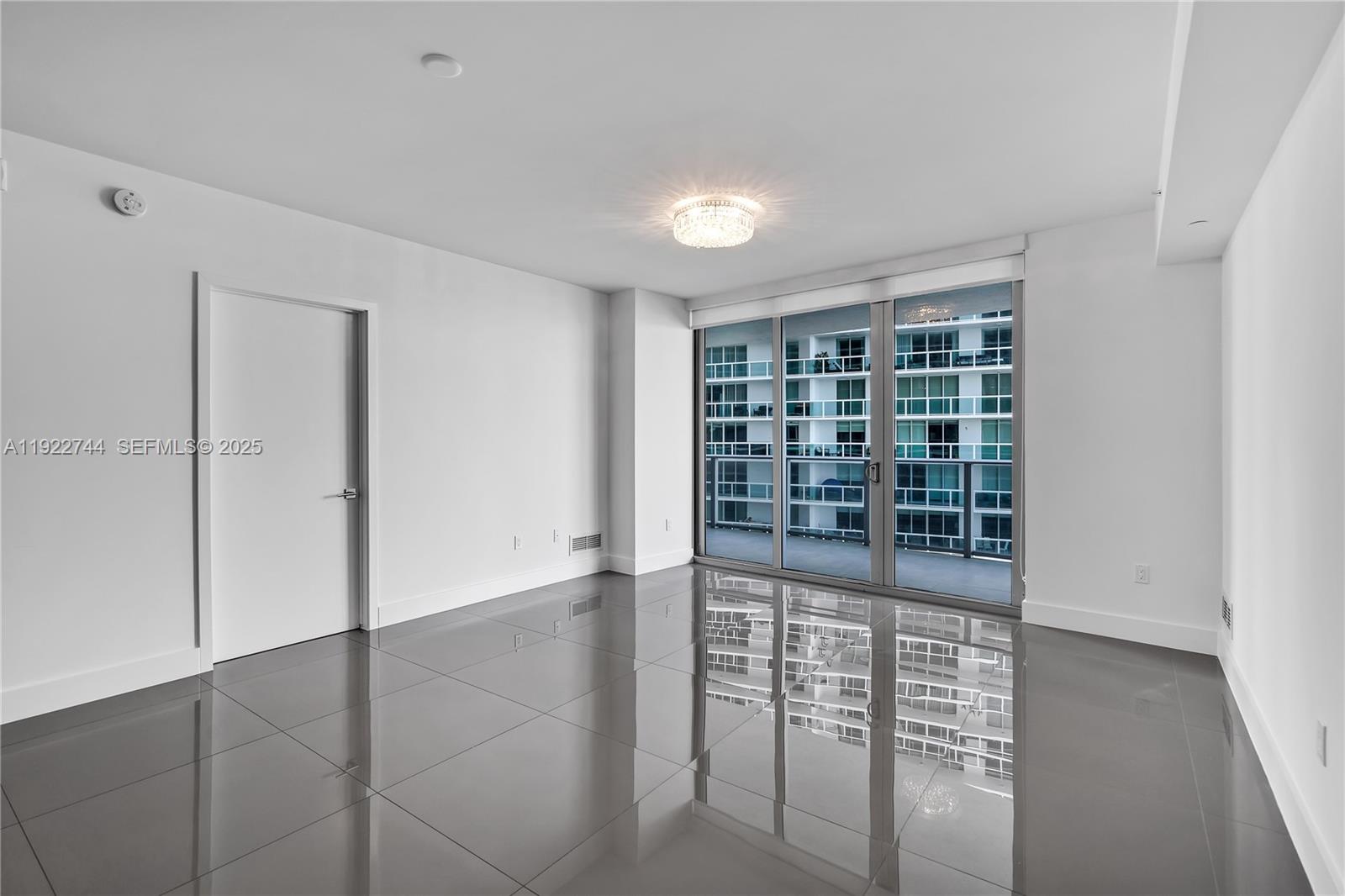 488 Northeast 18th Street, Unit 2311 Miami, FL 33132 - Photo 8 of 40 an empty room with windows