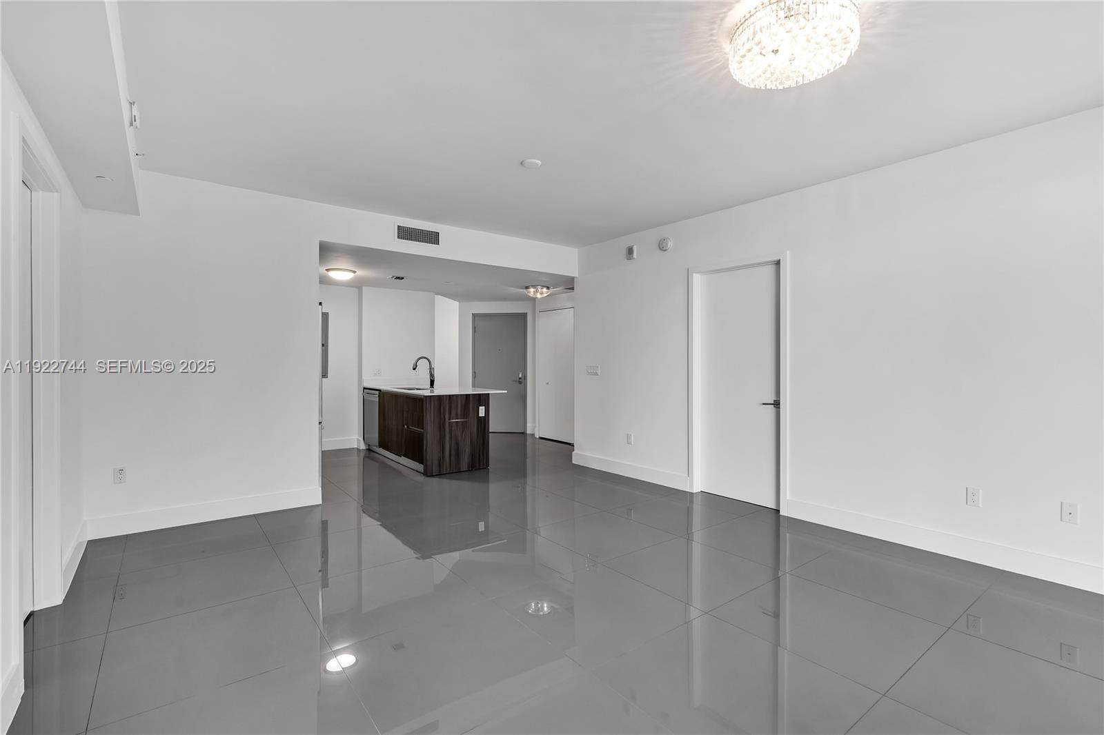 488 Northeast 18th Street, Unit 2311 Miami, FL 33132 - Photo 9 of 40 wooden floor in an empty room