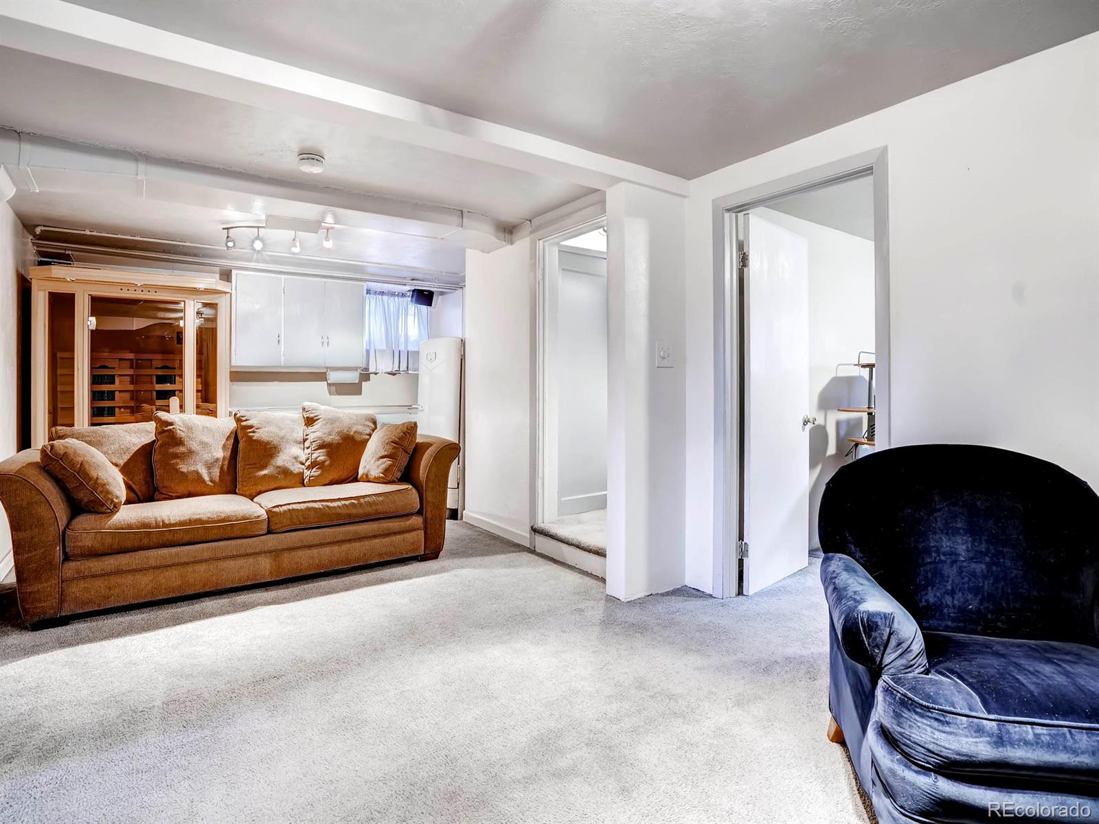 1370 Olive Street Denver, CO 80220 - Photo 19 of 27 a living room with furniture and a large window