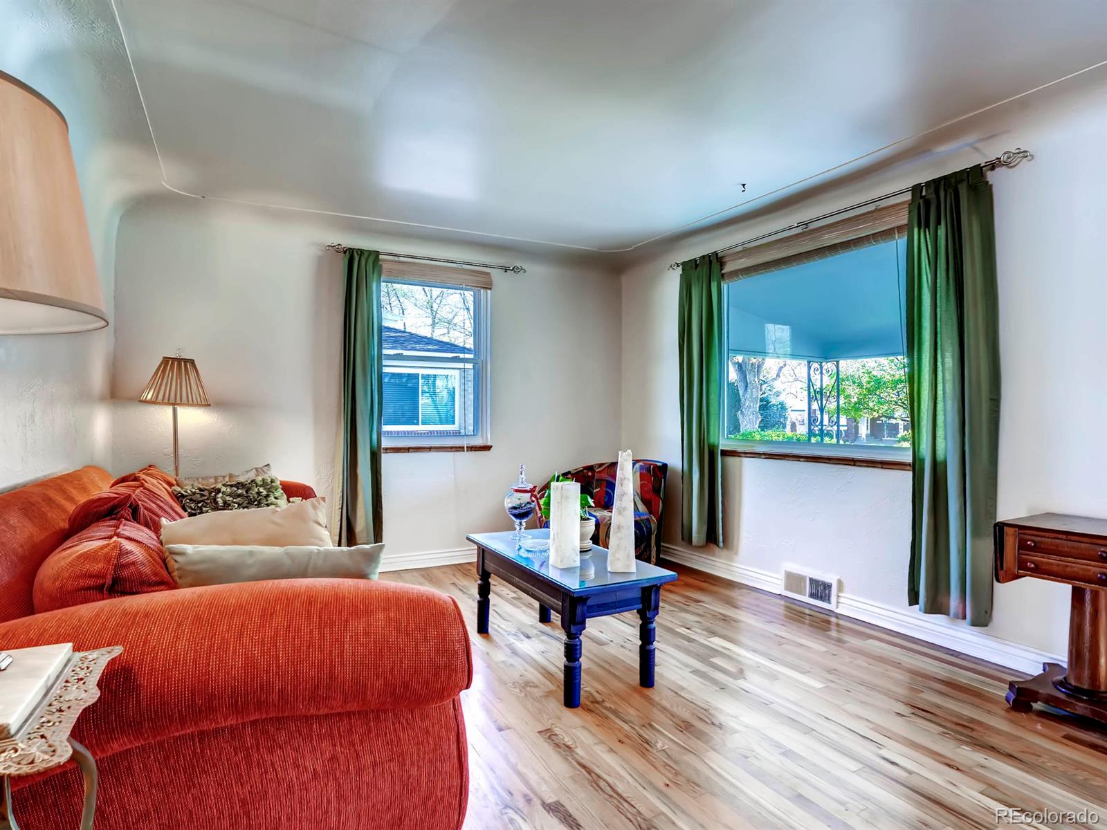 1370 Olive Street Denver, CO 80220 - Photo 2 of 27 a bedroom with bed and wooden floor