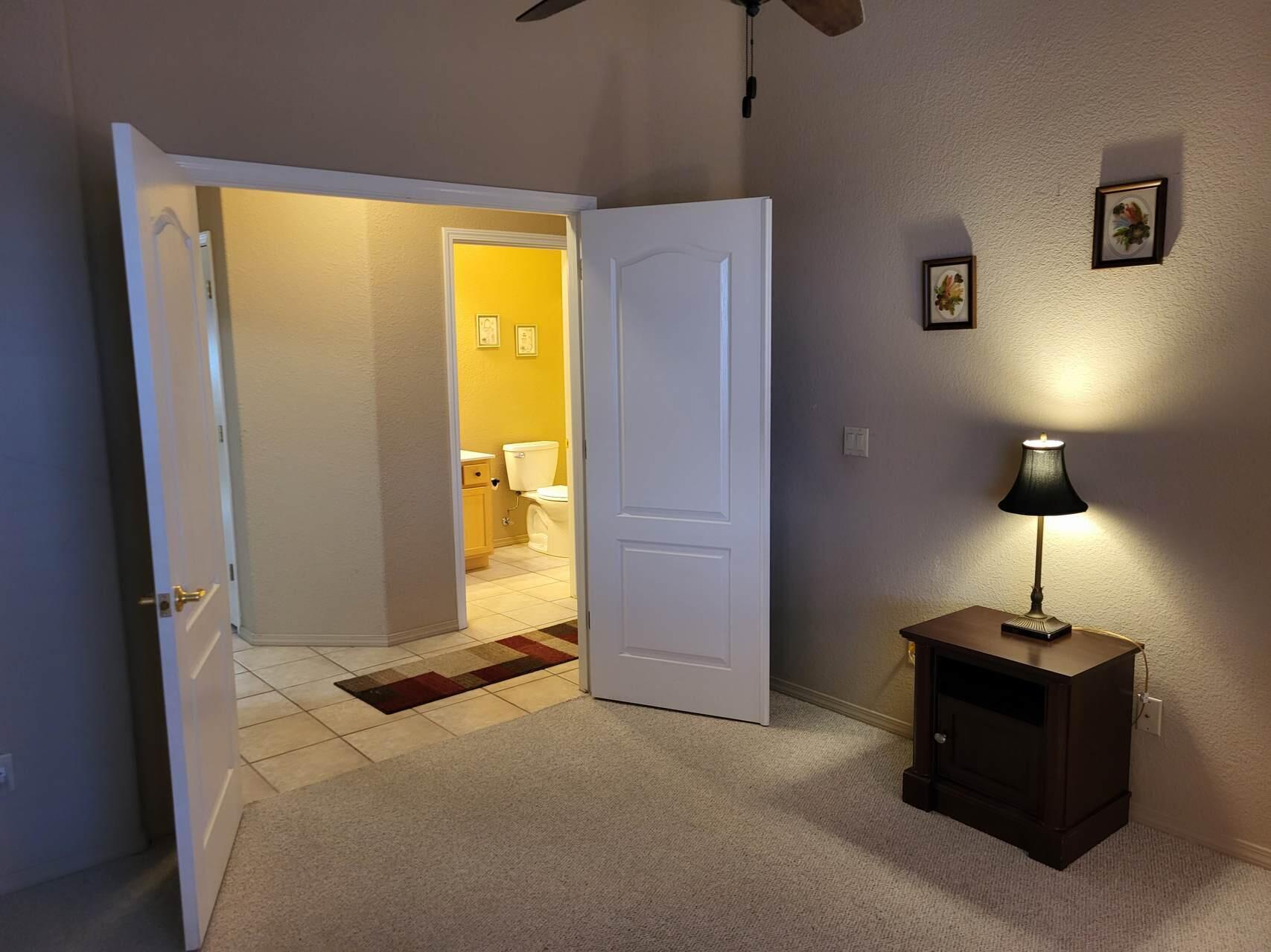 1120 South Sycamore Circle Payson, AZ 85541 - Photo 26 of 44 a bedroom with a bed and a lamp