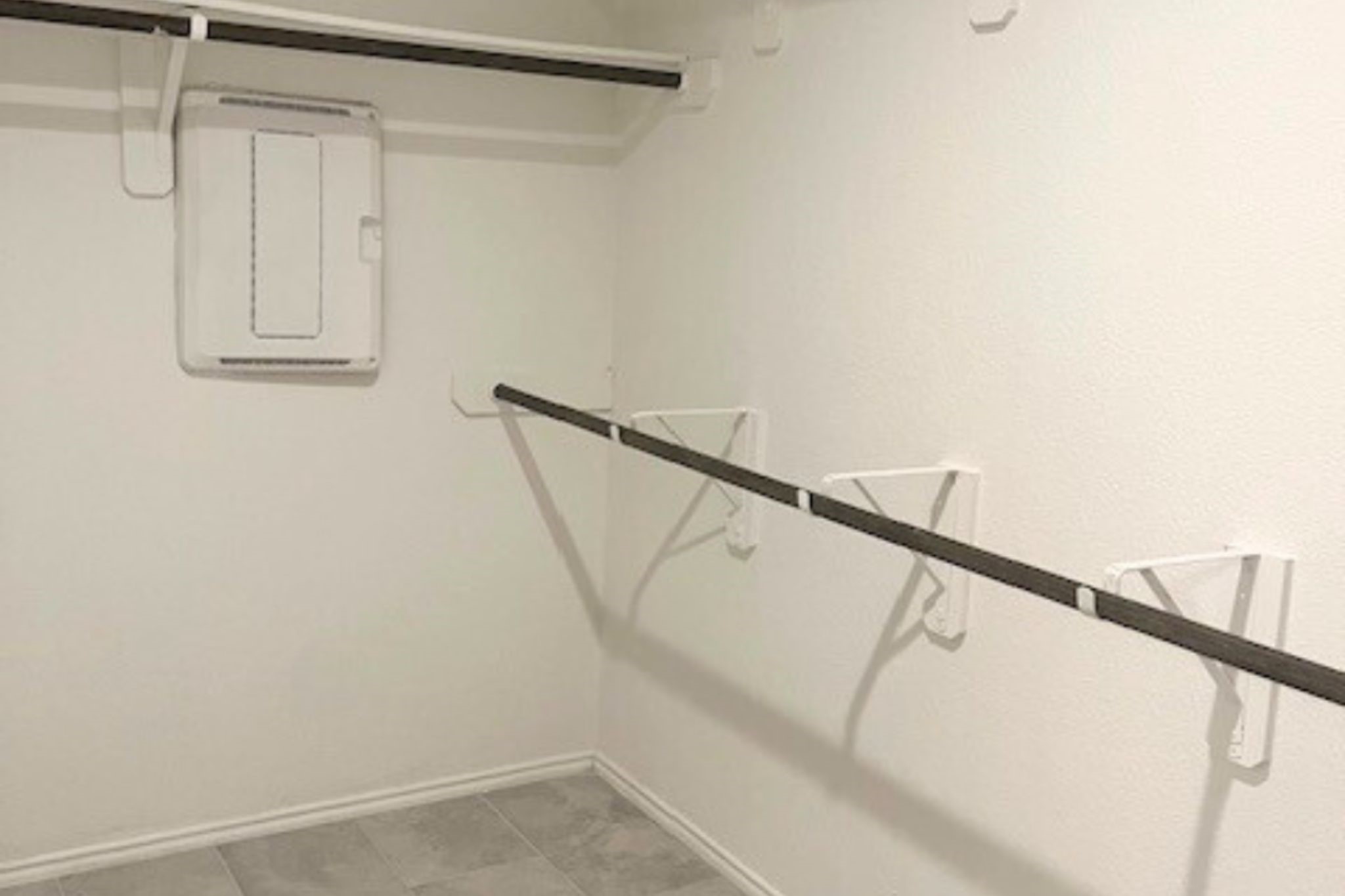 8310 Rose Petals Lane Rosharon, TX 77583 - Photo 18 of 43 Another view of the large walk-in closet in the primary suite, highlighting additional hanging racks and storage areas designed to maximize organization and functionality for clothing, shoes, and accessories.