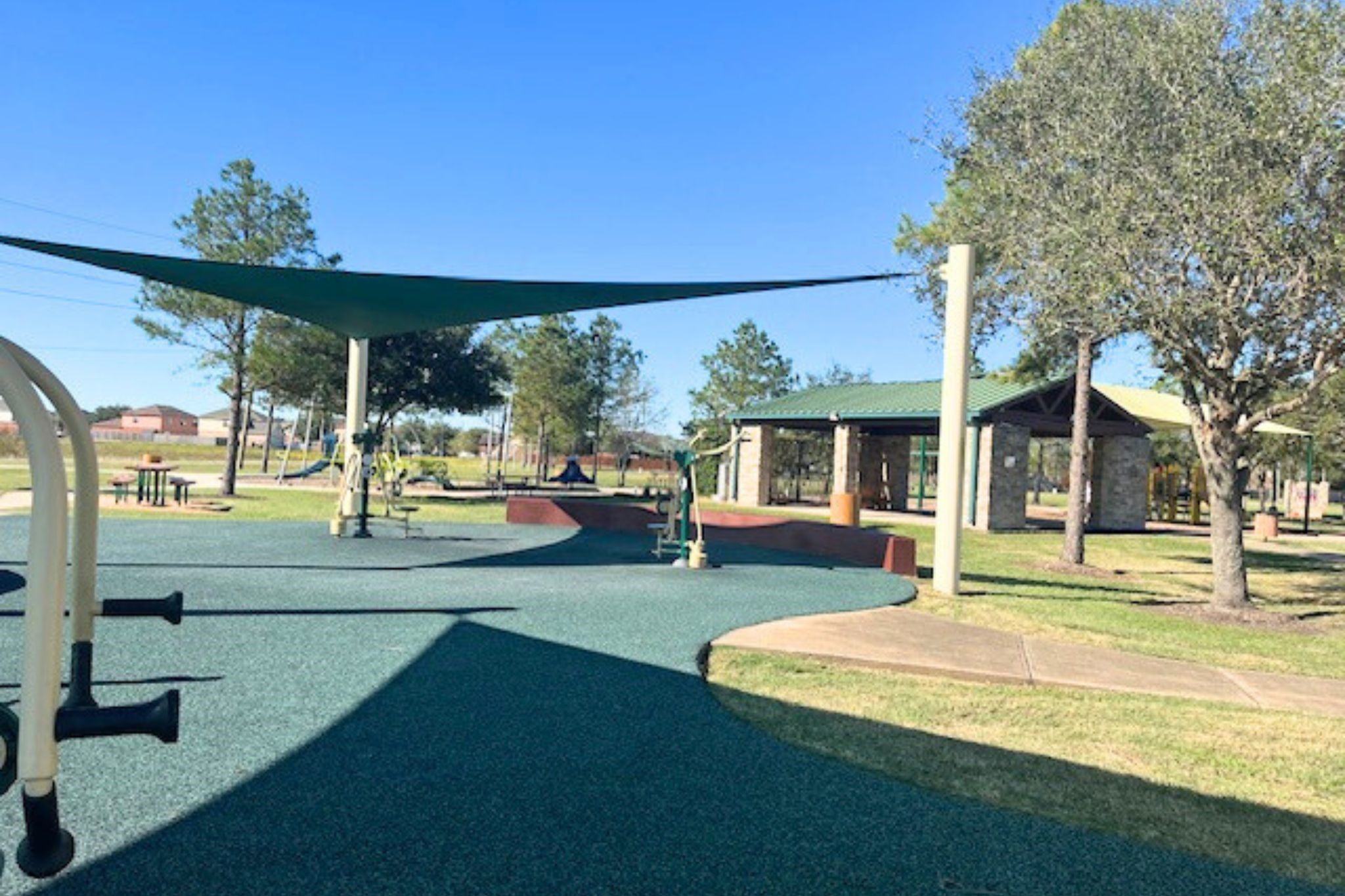 8310 Rose Petals Lane Rosharon, TX 77583 - Photo 33 of 43 Outdoor fitness area and activity park with shade structures and exercise stations, offering residents a convenient space for staying active while enjoying the outdoors.