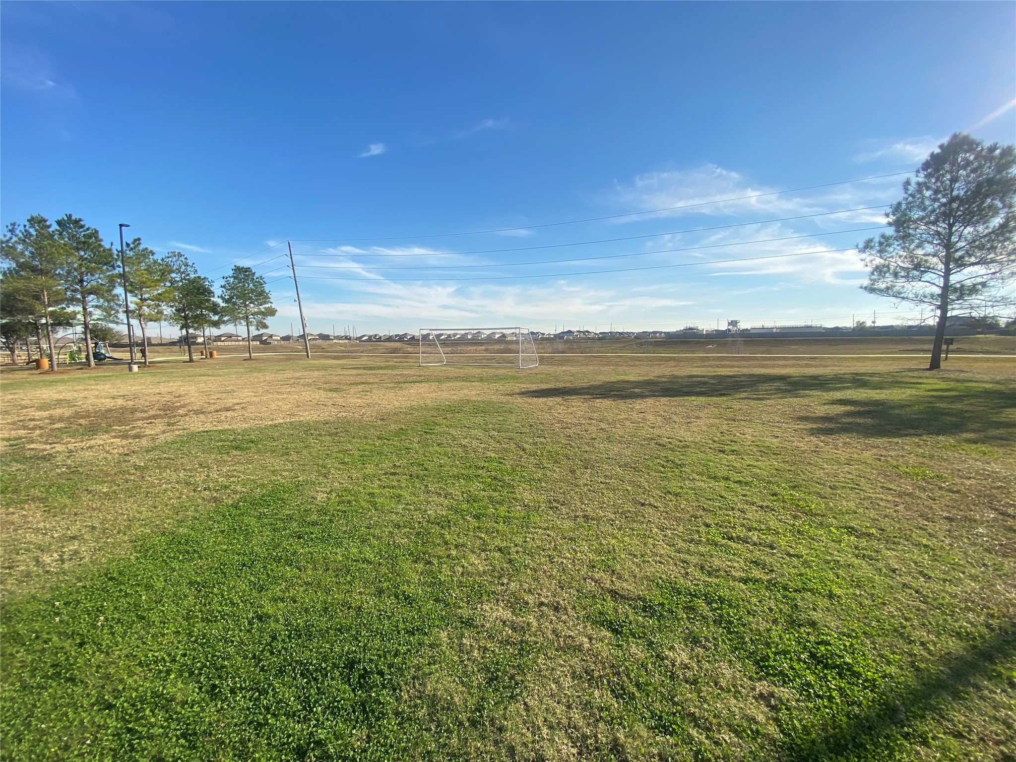 8310 Rose Petals Lane Rosharon, TX 77583 - Photo 37 of 43 Expansive community green space in Southern Colony featuring a soccer goal, open play field, and nearby walking and jogging trails. This park area offers residents plenty of room for outdoor activities, sports, and relaxing strolls while enjoying the neighborhood’s peaceful surroundings.