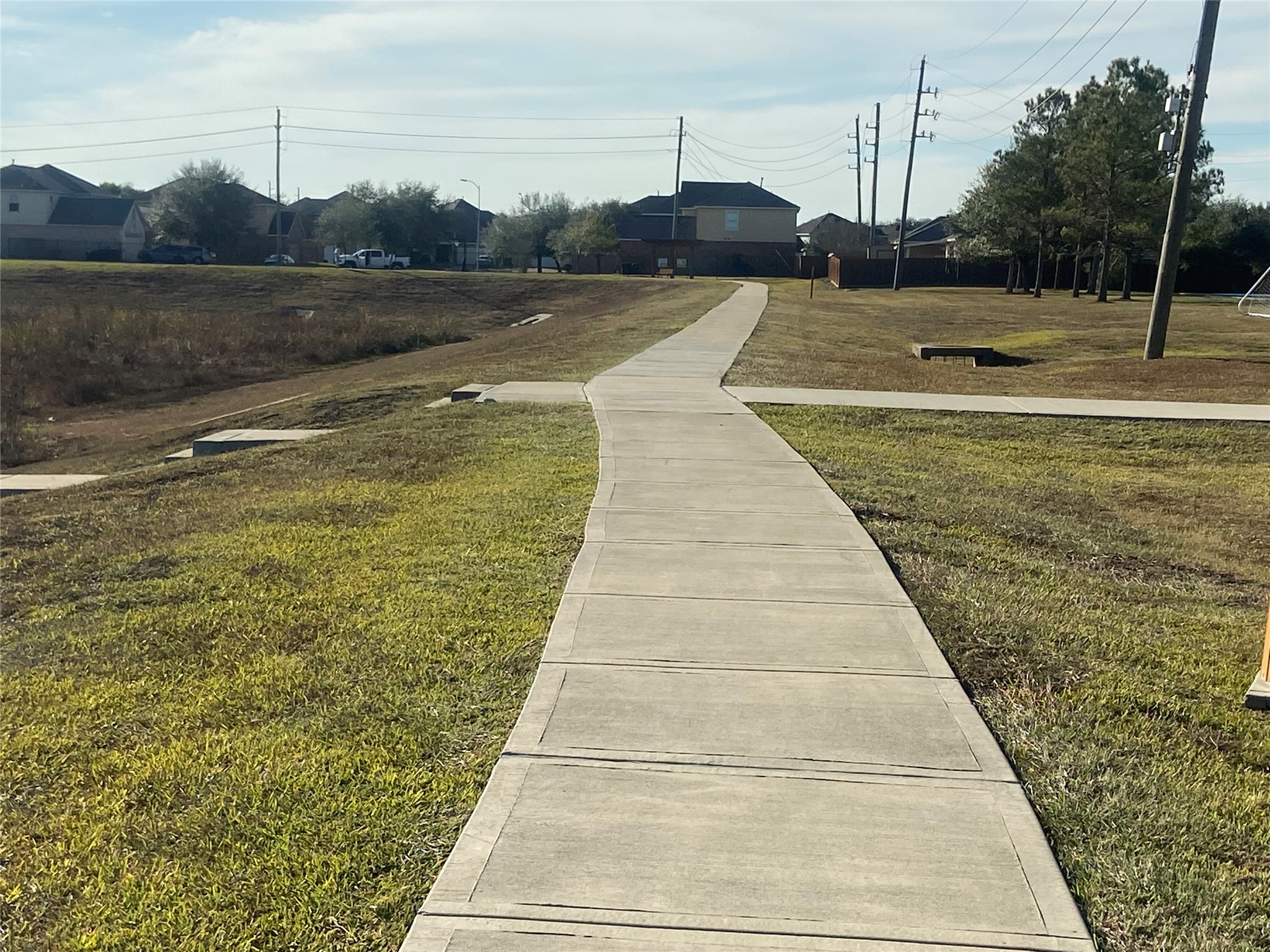 8310 Rose Petals Lane Rosharon, TX 77583 - Photo 38 of 43 Scenic walking and jogging trail in Southern Colony, winding through open green space and connecting residents to the neighborhood parks and recreational areas. This paved trail offers a perfect place for daily walks, jogging, or enjoying the outdoors in a peaceful community setting.