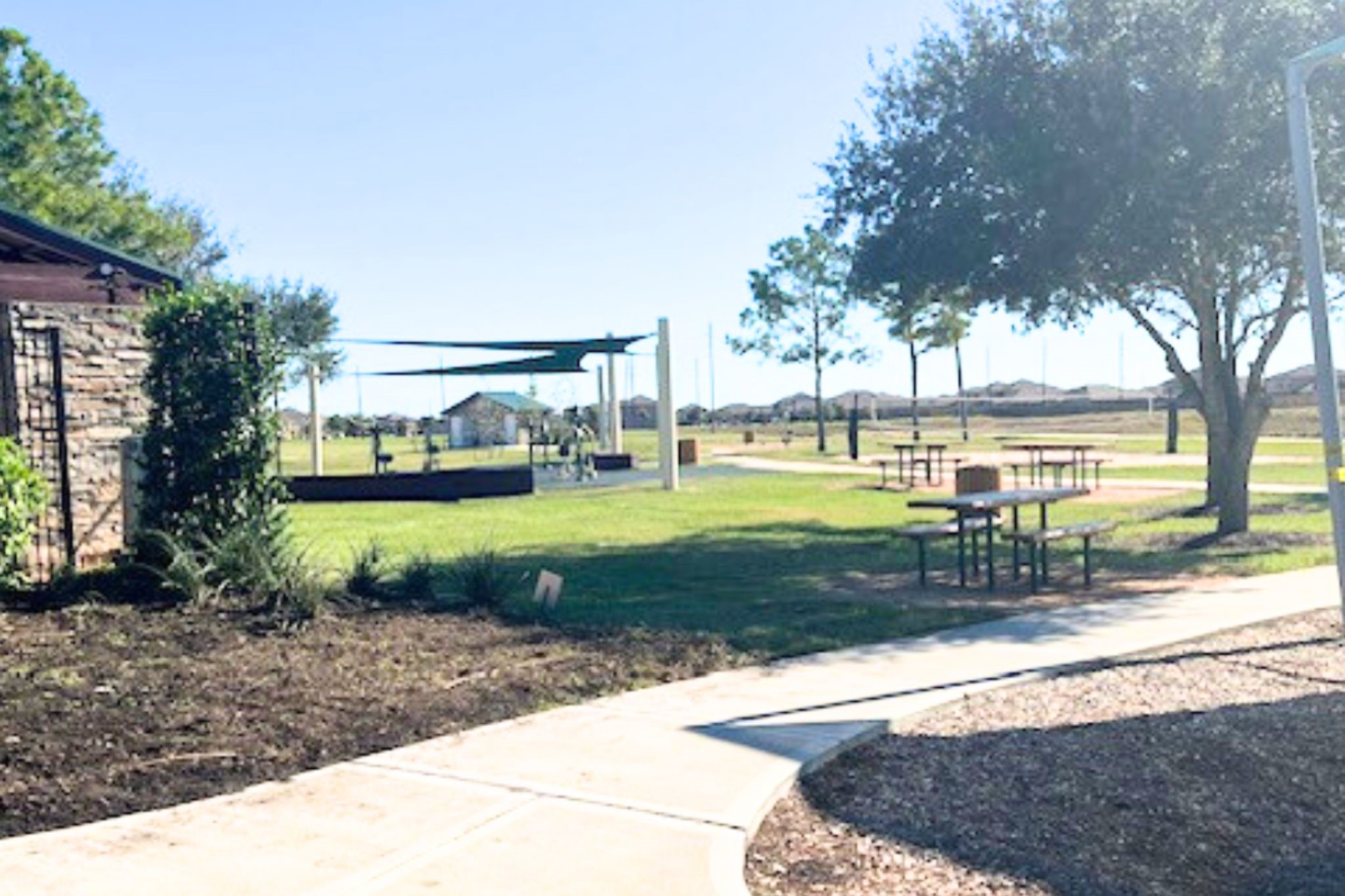 8310 Rose Petals Lane Rosharon, TX 77583 - Photo 41 of 43 Peaceful community park area in Southern Colony featuring shaded picnic tables, open green space, and nearby walking trails. Residents can enjoy outdoor gatherings, relaxing afternoons, or scenic walks while taking advantage of the neighborhood’s well-maintained recreational areas.