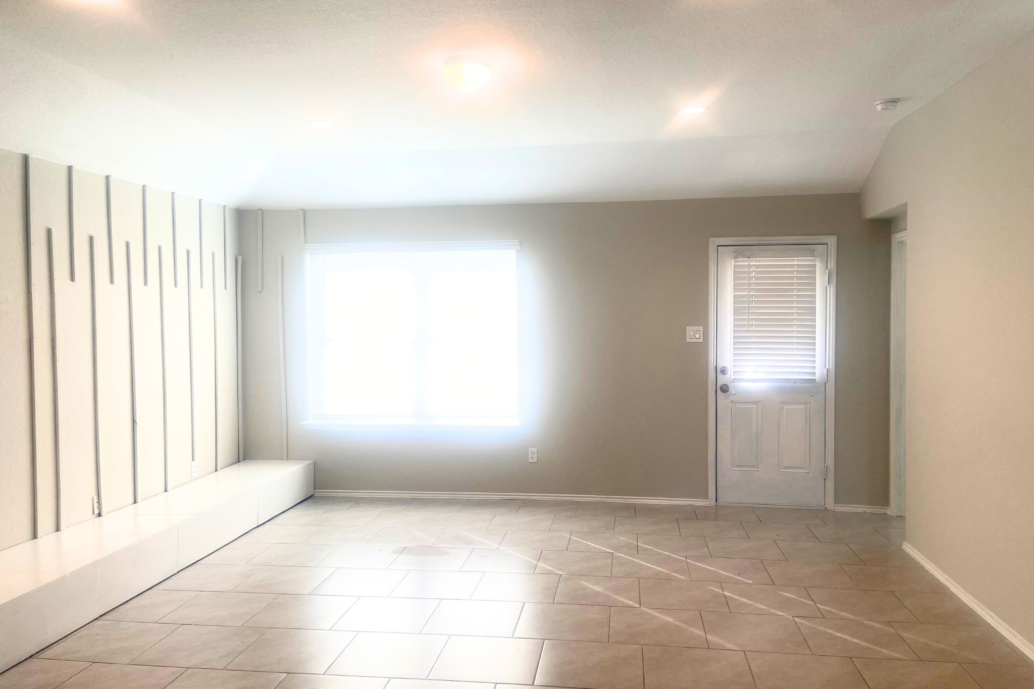 8310 Rose Petals Lane Rosharon, TX 77583 - Photo 8 of 43 Spacious sitting area. This versatile sitting area flows seamlessly toward the kitchen and provides direct access to the backyard, making it perfect for relaxing, entertaining, or spending time with family.