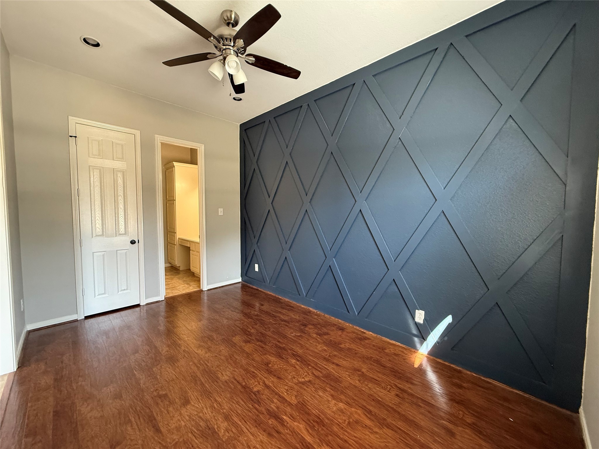 3517 Oak Landing Conroe, TX 77304 - Photo 19 of 28 wooden floor in an empty room with a window