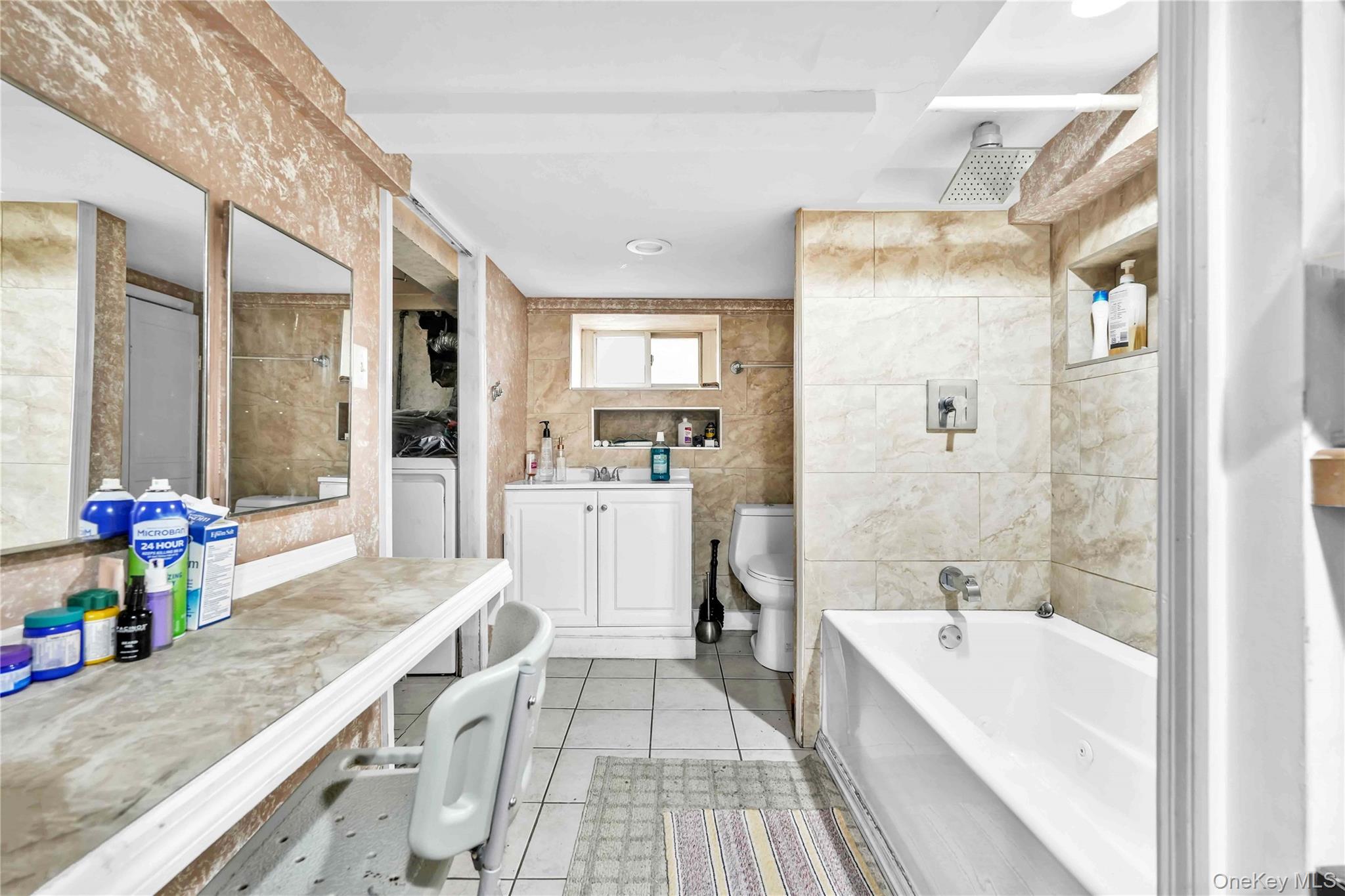 1623 George Street Queens, NY 11385 - Photo 15 of 21 a bathroom with a granite countertop sink a bathtub and a shower