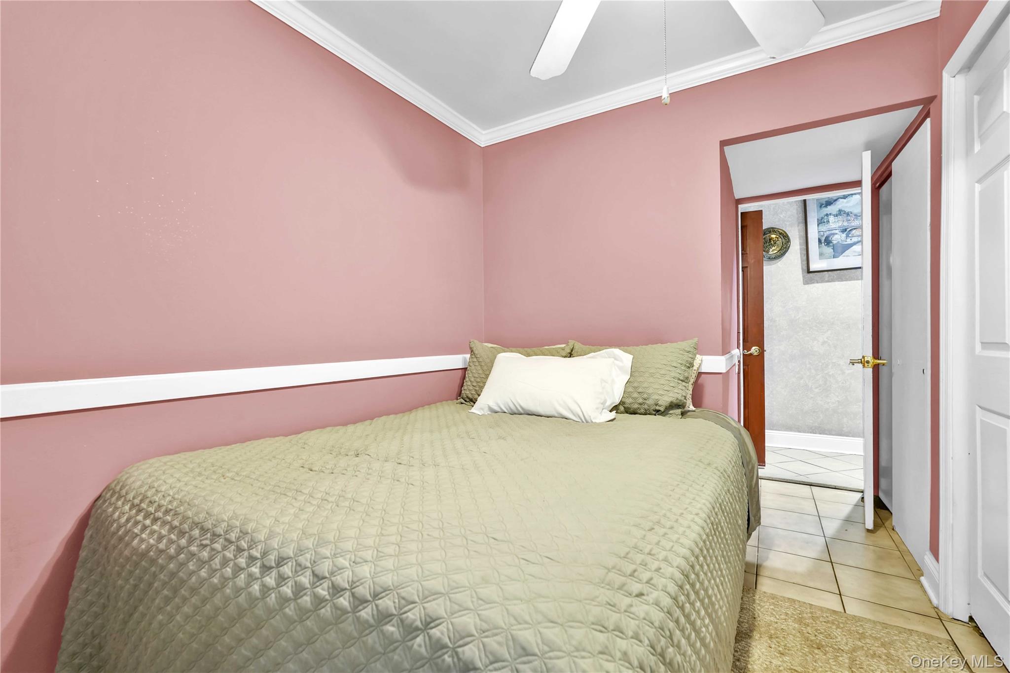 1623 George Street Queens, NY 11385 - Photo 7 of 21 a large bed sitting in a bedroom next to a window