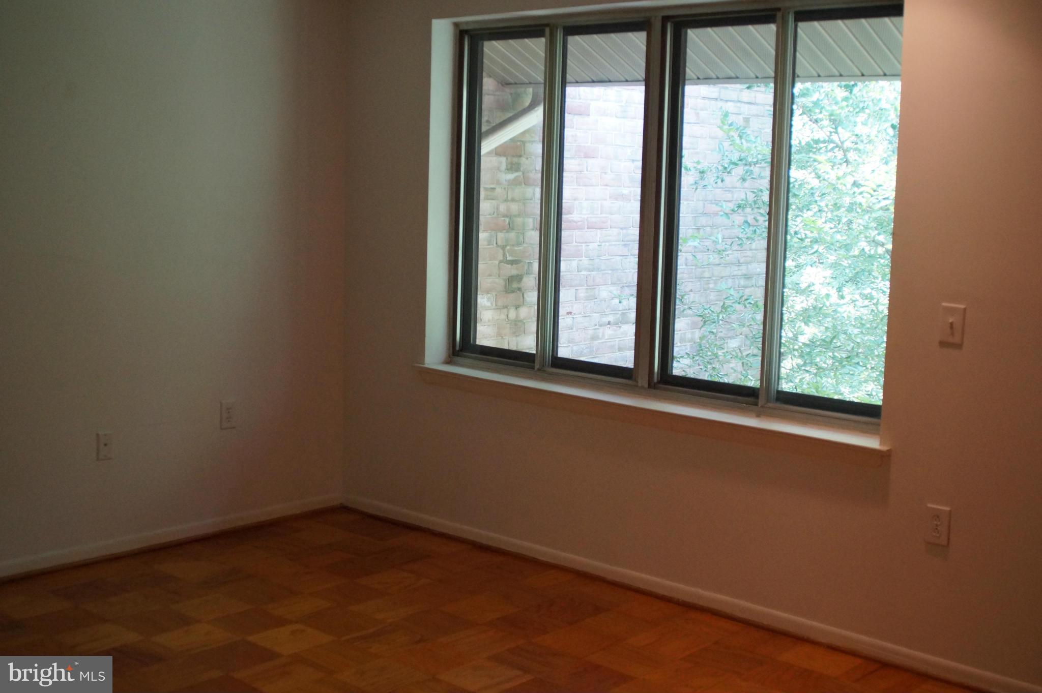 109 Cross Keys Road, Unit R109F Baltimore, MD 21210 - Photo 11 of 13 a view of a room that has a window