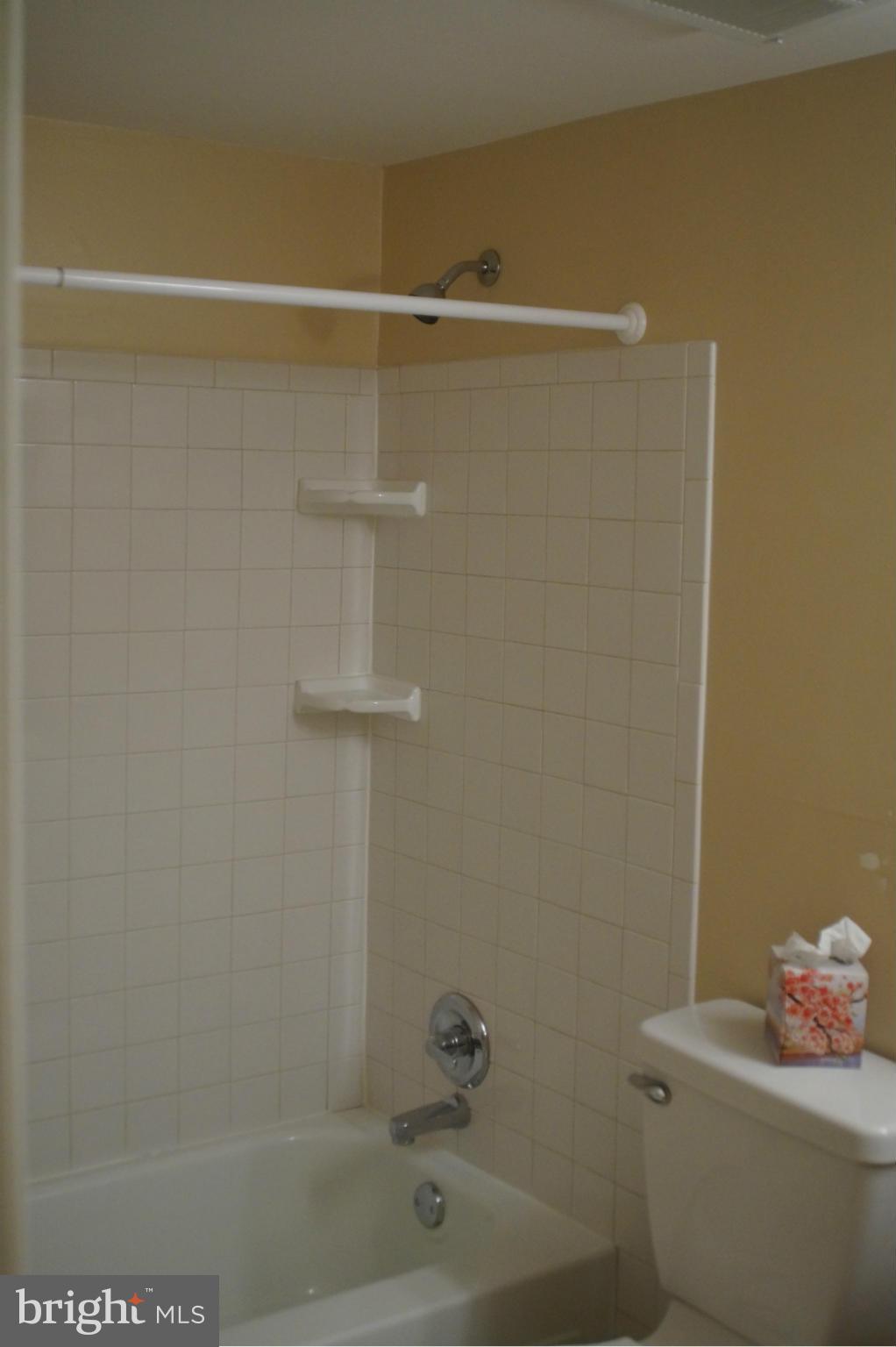 109 Cross Keys Road, Unit R109F Baltimore, MD 21210 - Photo 8 of 13 a bathroom with a shower