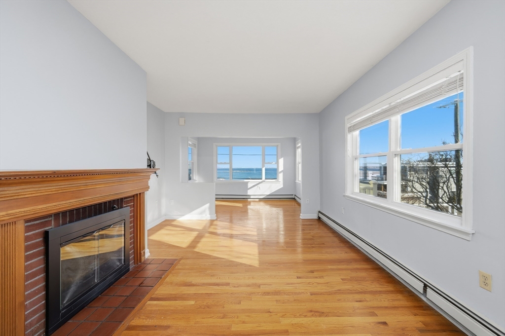 203 Endicott Avenue, Unit 2 Revere, MA 02151 - Photo 11 of 39 a view of living room with furniture and a fireplace