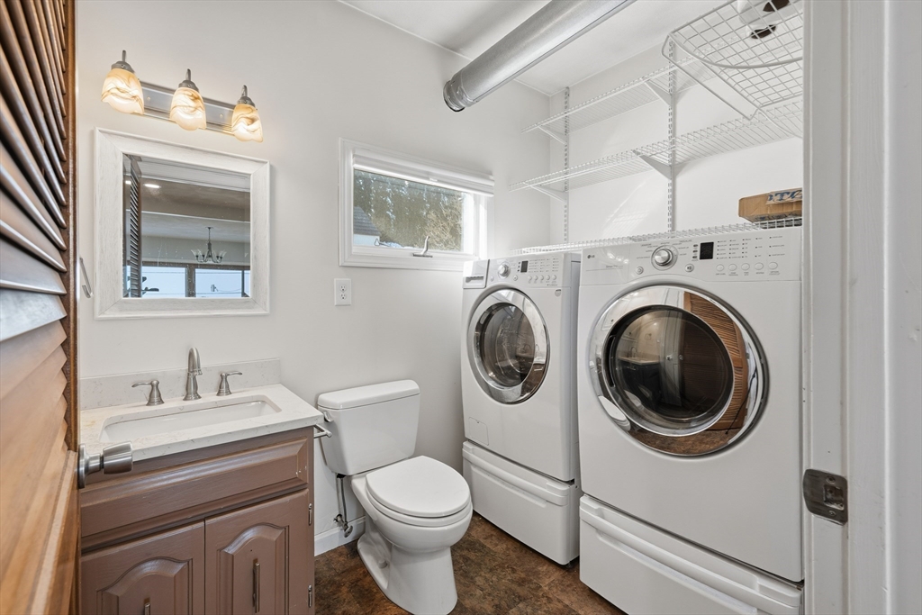 203 Endicott Avenue, Unit 2 Revere, MA 02151 - Photo 30 of 39 a white toilet sitting next to a bathroom sink
