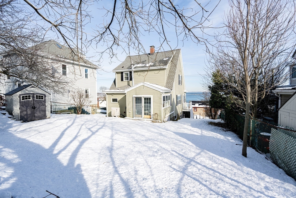 203 Endicott Avenue, Unit 2 Revere, MA 02151 - Photo 31 of 39 a view of a building with snow on the road