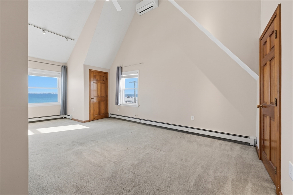 203 Endicott Avenue, Unit 2 Revere, MA 02151 - Photo 7 of 39 an empty room with windows