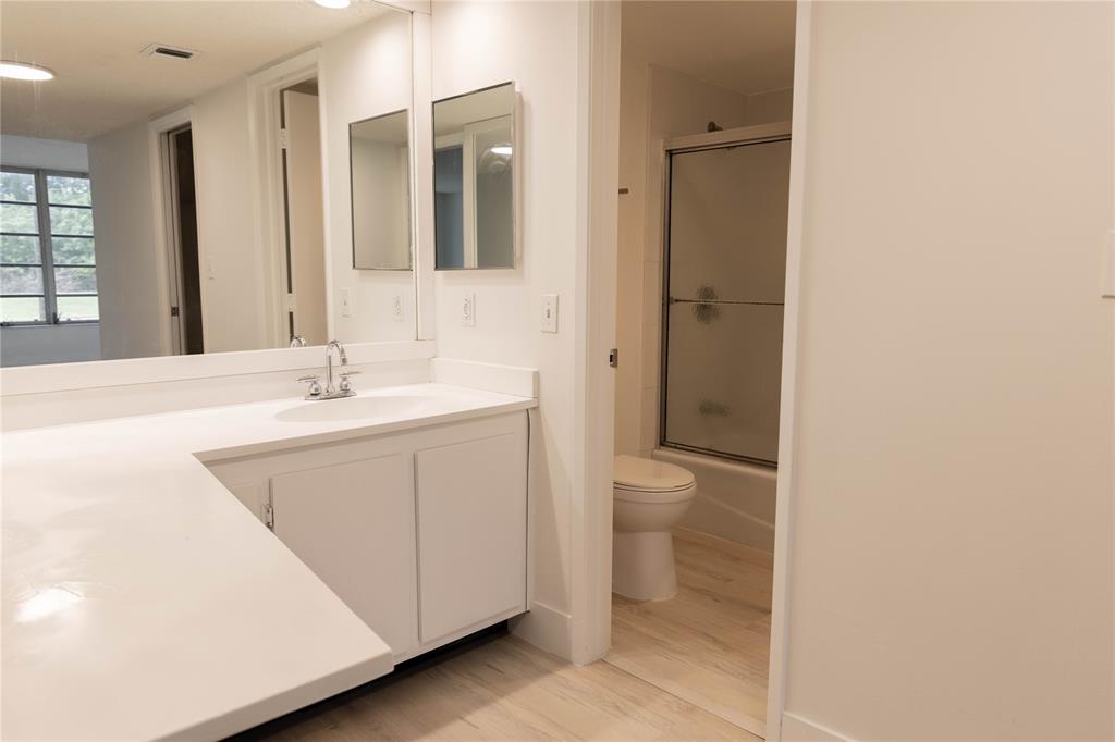 4007 North Cypress Drive, Unit 103 Pompano Beach, FL 33069 - Photo 19 of 25 a bathroom with a sink a toilet and shower