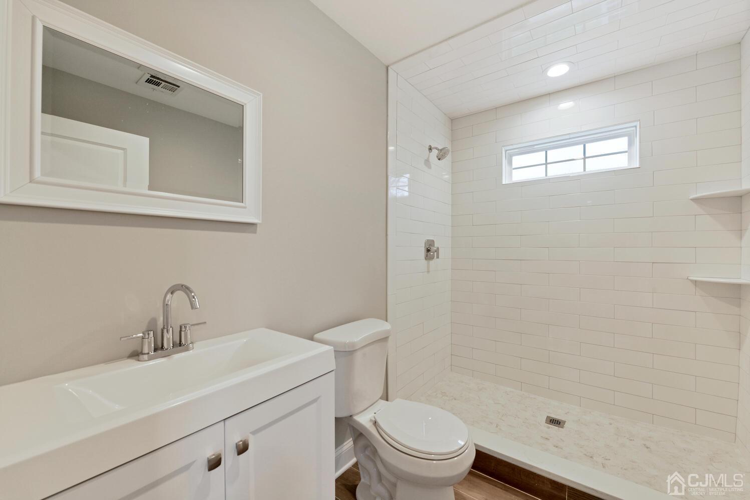 20 Sunset Drive Clark, NJ 07066 - Photo 25 of 32 a bathroom with a sink toilet and shower