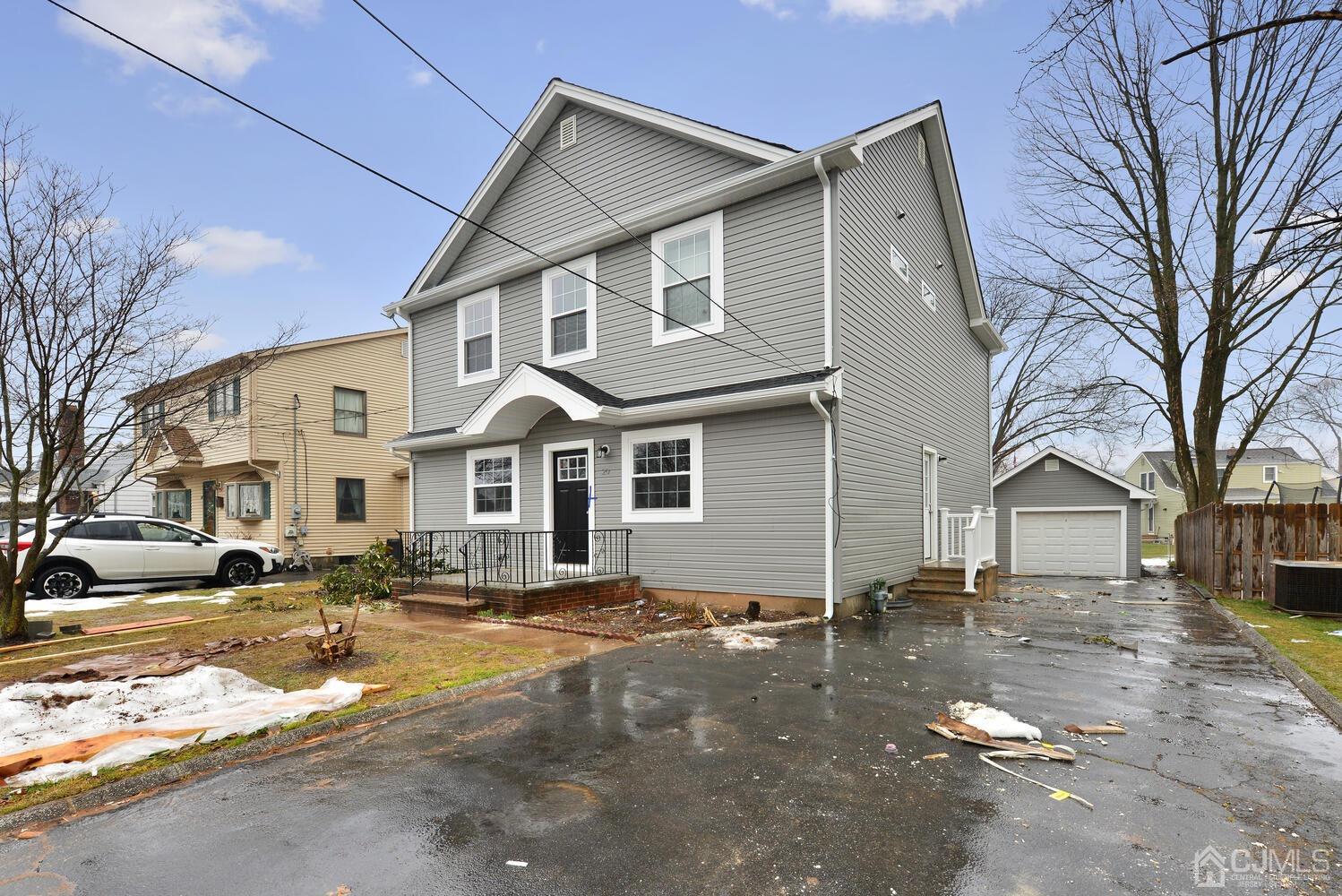 20 Sunset Drive Clark, NJ 07066 - Photo 3 of 32 a view of a white house with a large tree