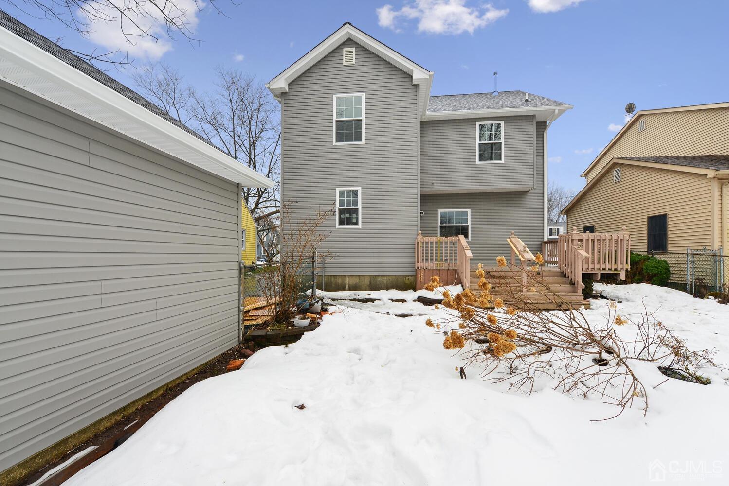20 Sunset Drive Clark, NJ 07066 - Photo 32 of 32 a view of a dinning table and chairs in the back yard of the house