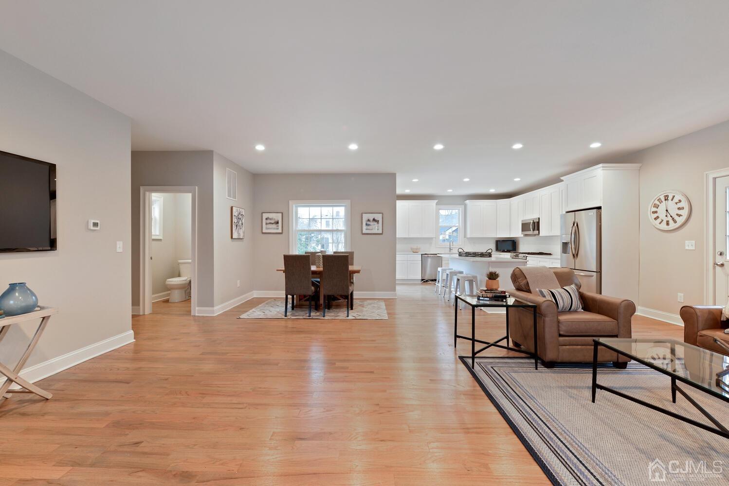 20 Sunset Drive Clark, NJ 07066 - Photo 6 of 32 a living room with furniture and a flat screen tv